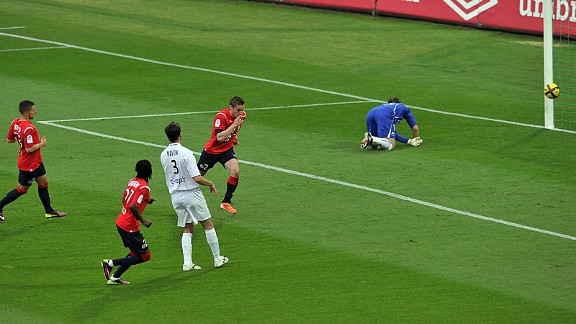 Mathieu Debuchy celebrates after scoring against Arles Avignon