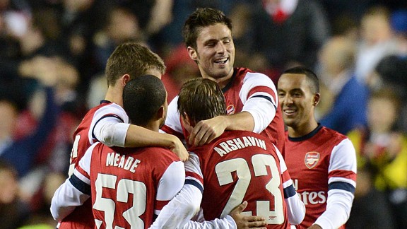 Arsenal celebrate after netting their seventh goal to complete their victory