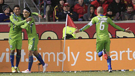 Seattle Sounders goal scorer Mario Martinez, left, celebrates with teammates Fredy Montero and Osvaldo Alonso