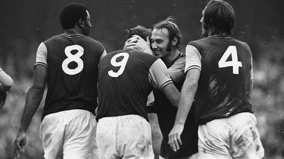 West Ham's Bryan 'Pop' Robson hugs the England hero Geoff Hurst