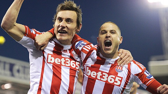 Dean Whitehead celebrates with Michael Kightly after scoring the winner at Stoke
