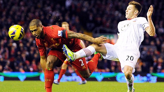 Adam Lallana gets a challenge in on Glen Johnson