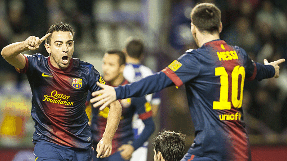 Xavi celebrates his opener at Valladolid with Lionel Messi