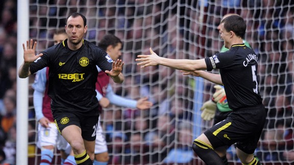 Ivan Ramis celebrates after giving Wigan the early lead at Aston Villa
