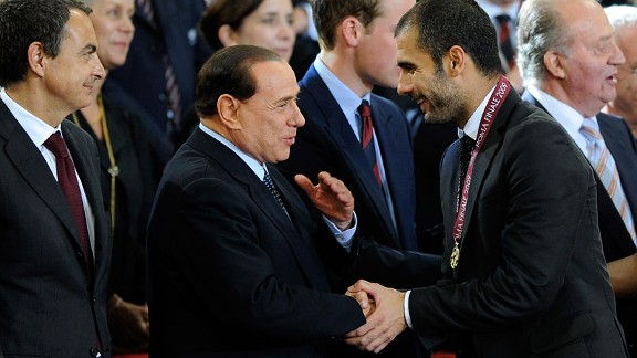 AC Milan president Silvio Berlusconi says he has met with former Barcelona manager Josep Guardiola.