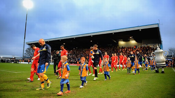 The show begins: Mansfield and Liverpool take to the pitch