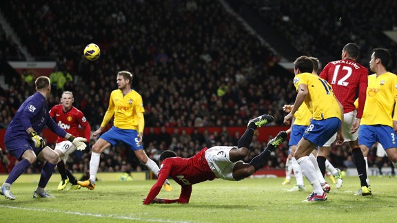 Patrice Evra sets up Wayne Rooney for his second goal of the night