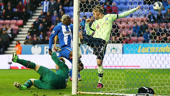 Arouna Kone forces home Wigan's late winner against Newcastle