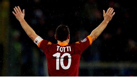 Roma's Francesco Totti salutes his fans after his latest goal for the club, against Parma