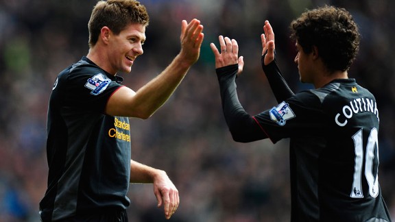 Phillipe Coutinho celebrates Liverpool taking the lead with captain Steven Gerrard