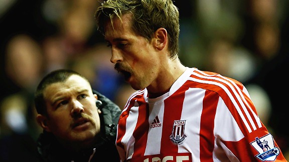 Peter Crouch goes off against Newcastle after a blow to the mouth