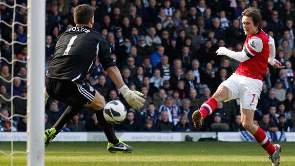Tomas Rosicky fires home his second goal of the game
