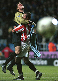 Thomas Sorensen and Emmerson Thome celebrate victory over Newcastle