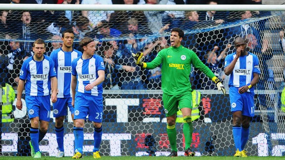 Wigan players show their frustration after Emmerson Boyce's late own goal handed Spurs a draw
