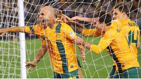 Australia celebrate Mark Bresciano's goal