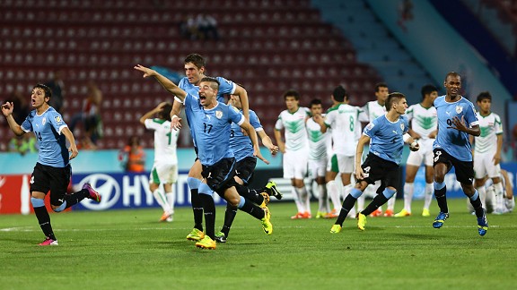 Uruguay's players celebrate their victory over Iraq in the penalty shootout of their Under-20 World Cup semifinal.
