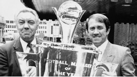 Everton manager Howard Kendall is presented with the Manager of the Year trophy by the previous winner, Liverpool's Joe Fagan, in 1985
