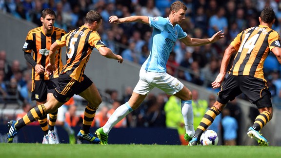 Edin Dzeko is crowded out during Manchester City's game against Hull.