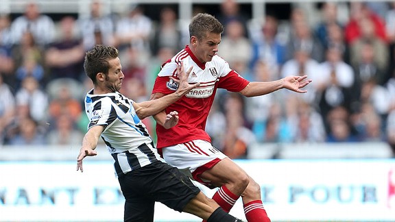 Yohan Cabaye (L) and Alex Kacaniklic (R) battle for the ball in Newcastle's win.