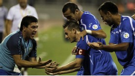 Uzbekistan captain Server Djeparov (C) celebrates after equalising against Jordan.