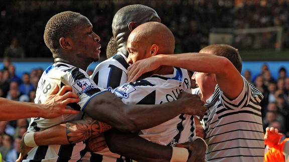 Yoan Gouffran is mobbed by fans and team-mates after restoring Newcastle's lead.