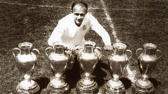 Alfredo Di Stefano poses with the five European Cups he won.