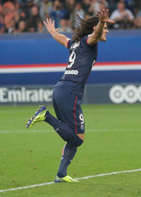 Edinson Cavani wheels away after hitting the back of the net for PSG against Toulouse.