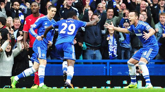 Chelsea celebrate after Samuel Eto'o fired them into the lead against Cardiff.