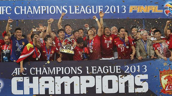 Guangzhou Evergrande lift the Asian Champions League trophy.