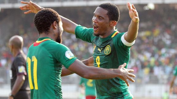 Cameroon striker Samuel Eto'o (right) hugs teammate Jean Makoun after he scored against Tunisia.