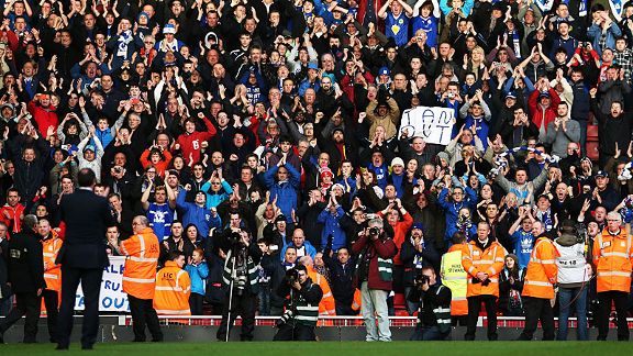Malky Mackay applauds the Cardiff fans at Anfield.
