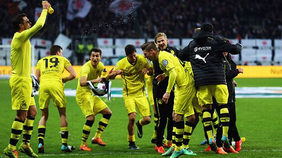 Borussia Dortmund celebrate their hard-earned cup win at Eintracht Frankfurt on Tuesday.