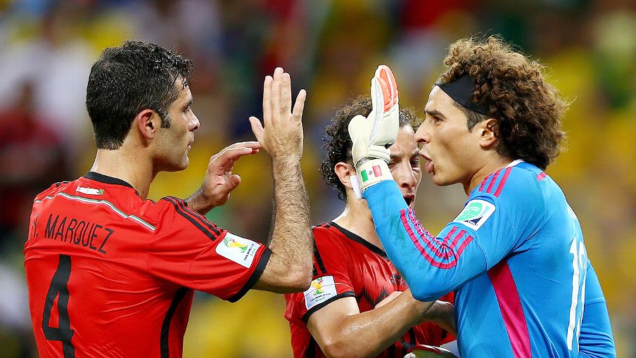 Guillermo 'Memo' Ochoa reacts to one of his splendid saves, with Rafael Marquez, left, and Andres Guardado.