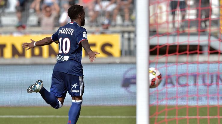 Lyon's French forward Alexandre Lacazette celebrates after scoring a goal in a 3-0 win versus Nancy.