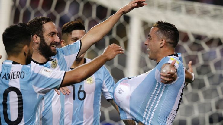 Argentina's Ramiro Funes Mori, right, celebrates with his teammates after scoring against Peru.