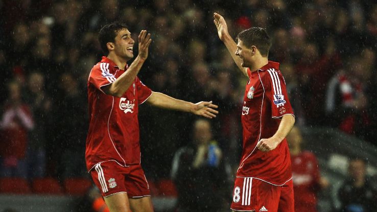 Steven Gerrard (R) of Liverpool is congratulated by teammate Alvaro Arbeloa after he scored against Luton Town in the FA Cup.