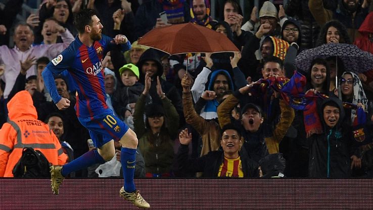 Lionel Messi celebrates one of his goals in Barca's defeat of Sevilla.