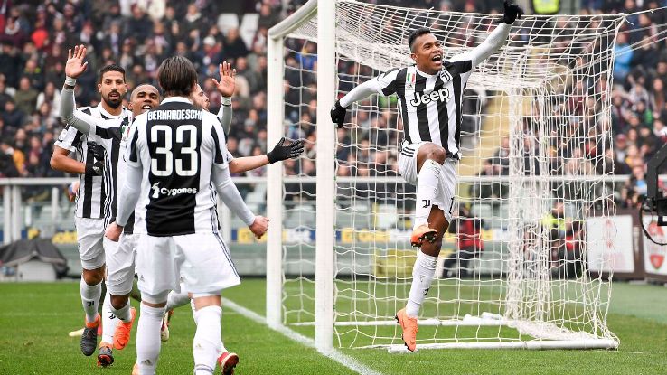 Alex Sandro celebrates after scoring for Juventus in their Serie A match against Torino.
