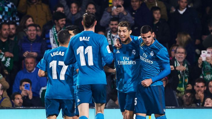 Cristiano Ronaldo celebrates with his Real Madrid teammates after scoring a goal.