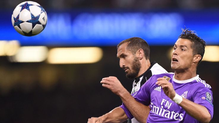 Juve's Giorgio Chiellini, left, battles for the ball with Real Madrid's Cristiano Ronaldo in the 2017 Champions League final.