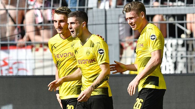 Christian Pulisic celebrates his fortunate opener.