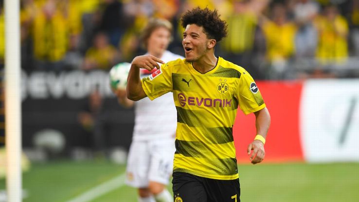 Jadon Sancho celebrates after scoring for Borussia Dortmund against Bayer Leverkusen.