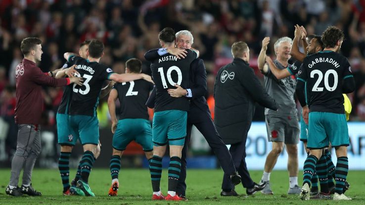 Southampton manager Mark Hughes (centre) celebrates with Charlie Austin after the final whistle.