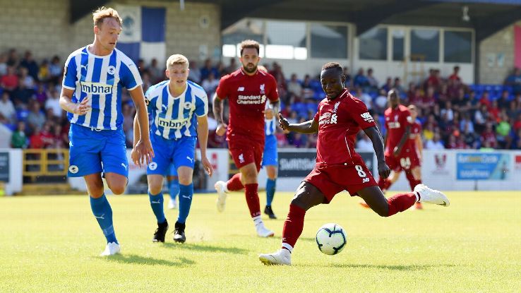 Liverpool's Naby Keita takes a shot during his debut in a friendly against Chester FC.