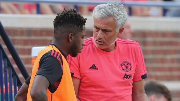 Jose Mourinho talks with Fred during Manchester United's International Champions Cup loss to Liverpool.