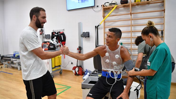 Juventus' Cristiano Ronaldo and Gonzalo Higuain go through medical tests.