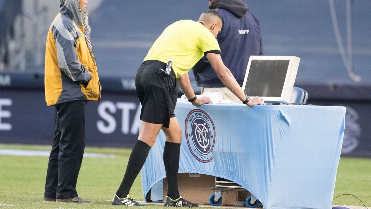 Referee Ismail Elfath reviews a play (VAR) before rewarding a penalty kick to New York City FC.