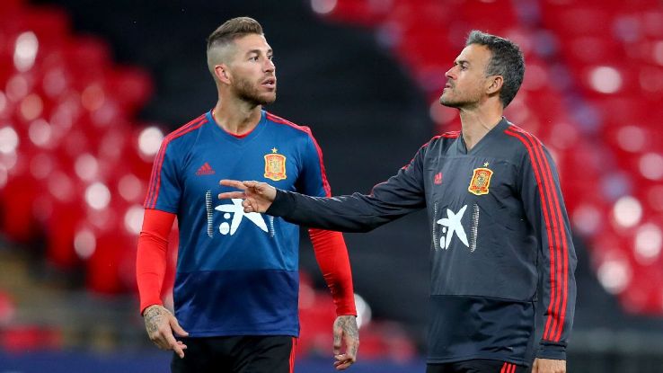 Luis Enrique, right, didn't even meet up with Spain captain Sergio Ramos, left, until the players arrived for the international break. It's by choice on the manager's part. He's in charge.