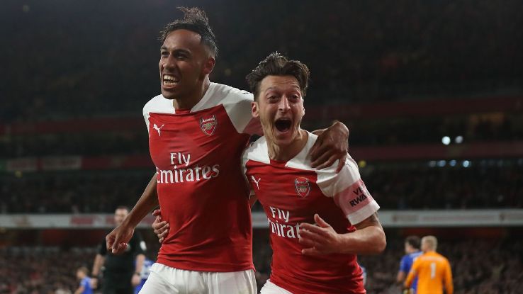 Pierre-Emerick Aubameyang and Mesut Ozil celebrate during Arsenal's Premier League match against Leicester City.