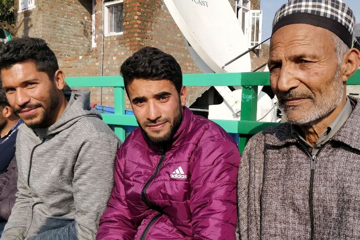 Zahid Yakub (left), who had played for the first Kashmiri team that made it to the I-League second division, watched the game from the stands.